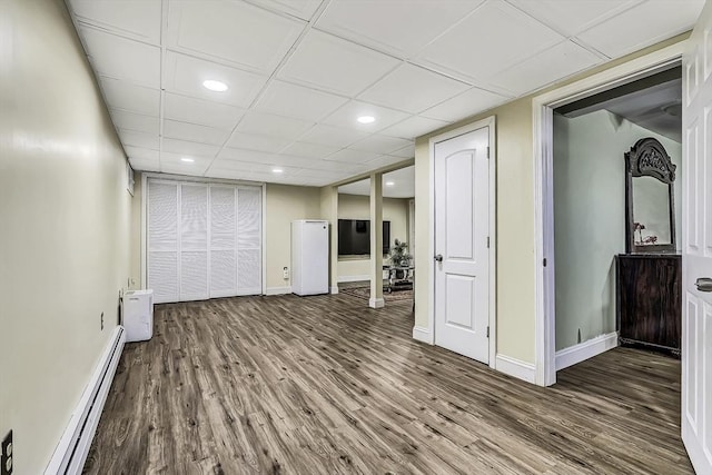 56 Ireta Rd, Shrewsbury, MA 01545 - finished below grade area featuring baseboard heating, wood finished floors, recessed lighting, and baseboards