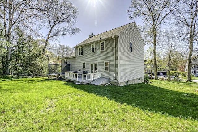 56 Ireta Rd, Shrewsbury, MA 01545 - back of house with a deck, a lawn, a chimney, and a shingled roof