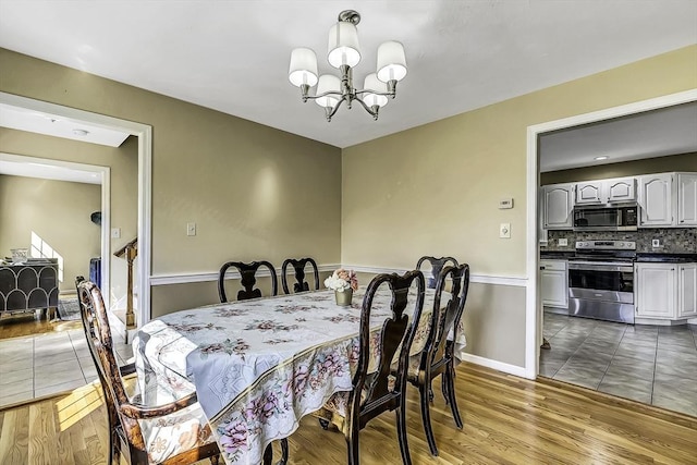 56 Ireta Rd, Shrewsbury, MA 01545 - dining space featuring a chandelier and wood finished floors