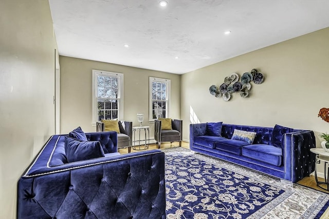 56 Ireta Rd, Shrewsbury, MA 01545 - living area with wood finished floors, recessed lighting, and a baseboard heating unit