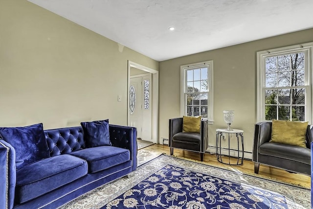 56 Ireta Rd, Shrewsbury, MA 01545 - living room with wood finished floors, baseboard heating, recessed lighting, and a baseboard heating unit