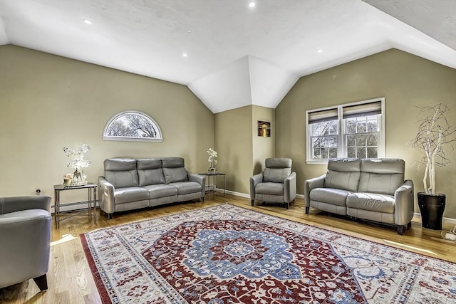 56 Ireta Rd, Shrewsbury, MA 01545 - living room with lofted ceiling, healthy amount of natural light, baseboard heating, wood finished floors, and recessed lighting