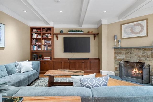 living room with beam ceiling, recessed lighting, light wood finished floors, and a fireplace