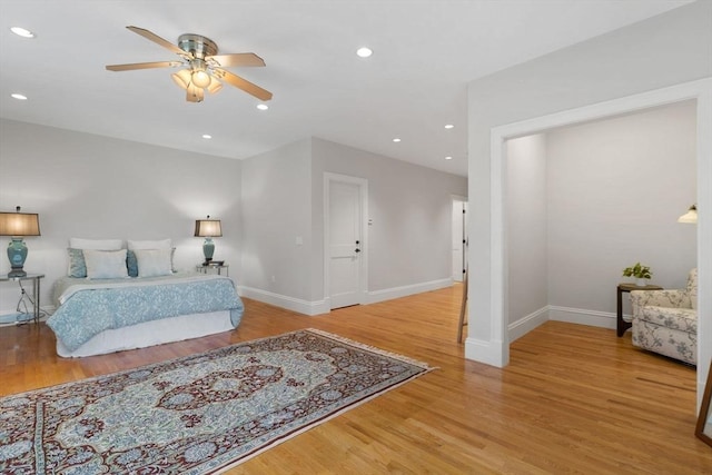 bedroom with recessed lighting, baseboards, wood finished floors, and ceiling fan