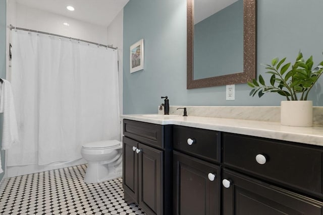 full bathroom with vanity, toilet, and recessed lighting