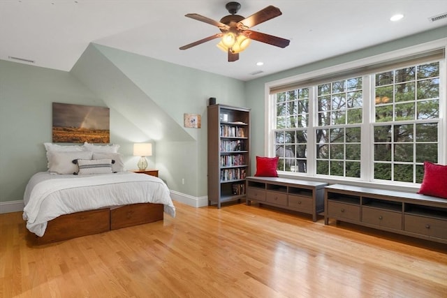 bedroom featuring recessed lighting, wood finished floors, baseboards, and ceiling fan