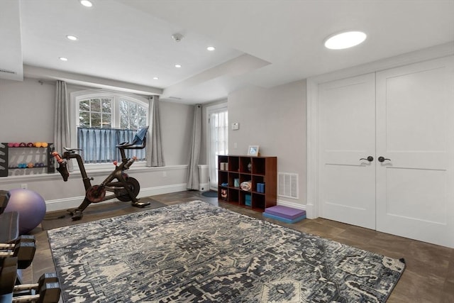 exercise area with recessed lighting, baseboards, and visible vents