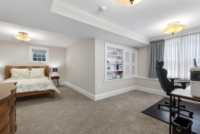 bedroom featuring baseboards and carpet floors