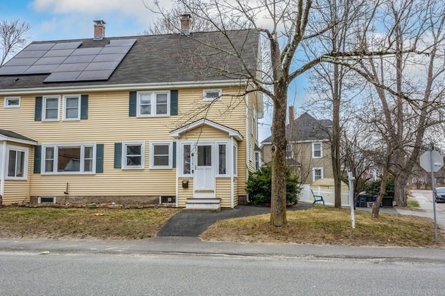 view of front of house with solar panels