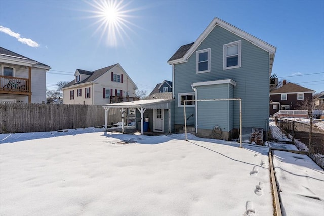 view of snow covered house