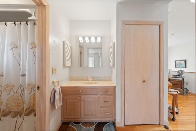 full bath featuring wood finished floors and vanity