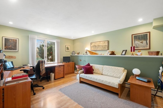 office with a baseboard heating unit, recessed lighting, and wood finished floors