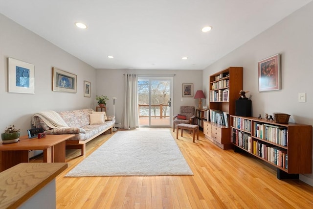 sitting room with light wood-style flooring, recessed lighting, and baseboard heating