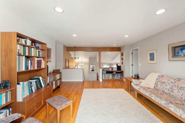 living room with recessed lighting and wood finished floors