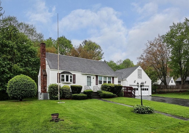 20 Amherst St, Grafton, MA 01536 - cape cod-style house with asphalt driveway, a chimney, and a front yard