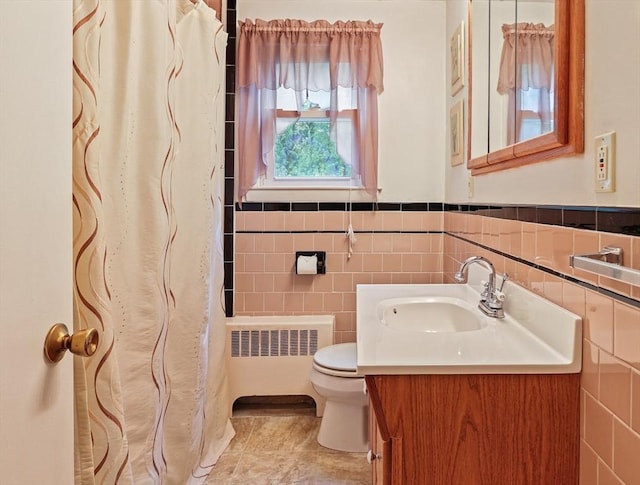 20 Amherst St, Grafton, MA 01536 - bathroom featuring radiator, toilet, vanity, tile walls, and a shower with curtain