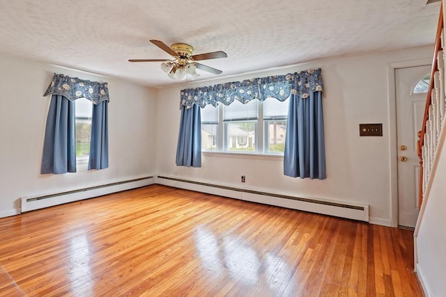 20 Amherst St, Grafton, MA 01536 - unfurnished room with healthy amount of natural light, stairs, wood-type flooring, a ceiling fan, and a textured ceiling