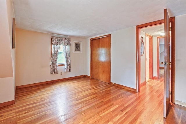 20 Amherst St, Grafton, MA 01536 - unfurnished bedroom with light wood-style flooring, baseboards, and a closet
