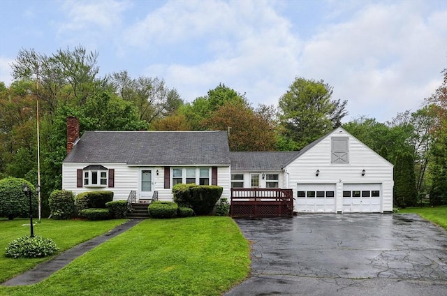 20 Amherst St, Grafton, MA 01536 - view of front of property with driveway, a chimney, a front yard, and an attached garage