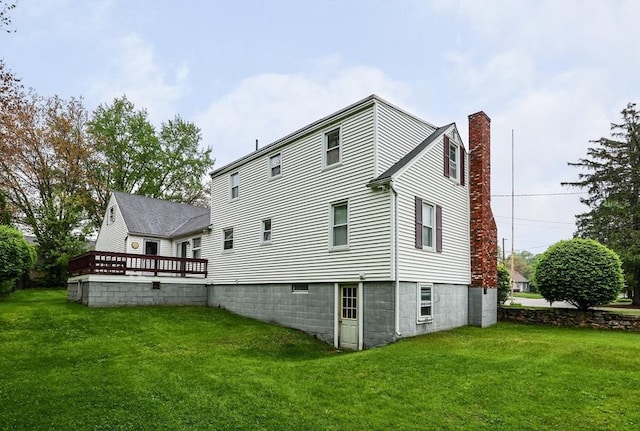 20 Amherst St, Grafton, MA 01536 - back of property with a chimney, a yard, and a deck