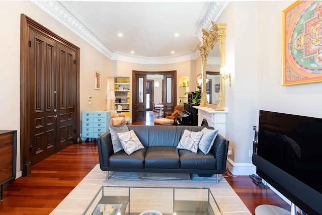 living room with crown molding and dark hardwood / wood-style flooring