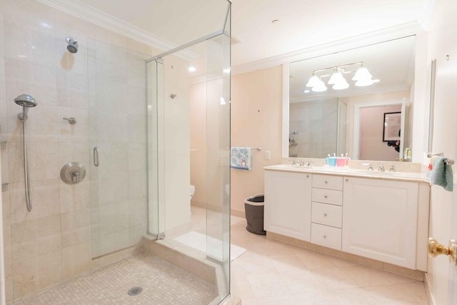 bathroom with vanity, a shower with door, and crown molding