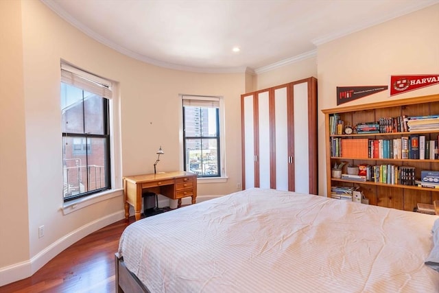 bedroom featuring dark hardwood / wood-style floors and ornamental molding