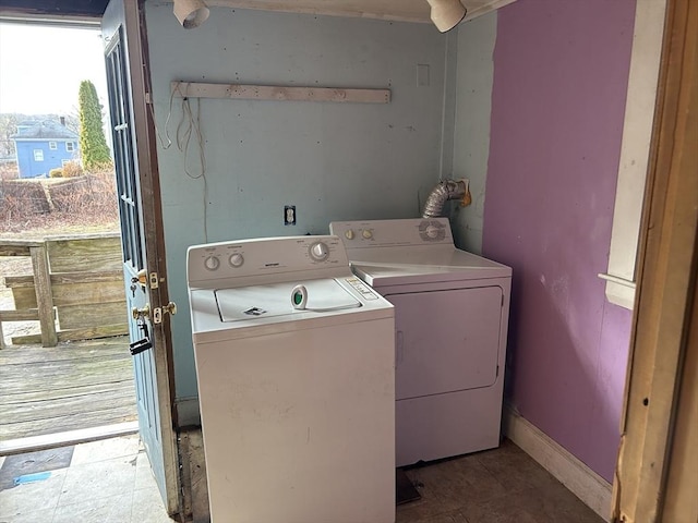 clothes washing area featuring washing machine and clothes dryer