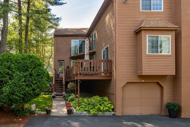 3 Treasure Way Unit 3, Ashland, MA 01721 - rear view of property featuring stairs, a wooden deck, a garage, and asphalt driveway