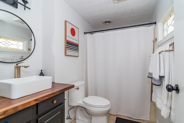 3 Treasure Way Unit 3, Ashland, MA 01721 - full bath featuring vanity, tile patterned flooring, a textured ceiling, and a shower with shower curtain
