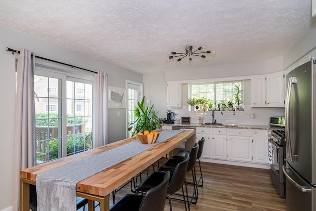 3 Treasure Way Unit 3, Ashland, MA 01721 - kitchen featuring stainless steel appliances, a textured ceiling, white cabinetry, dark wood-style flooring, and light stone countertops