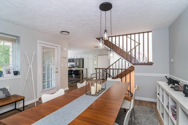 3 Treasure Way Unit 3, Ashland, MA 01721 - dining area with wood finished floors, stairs, and a textured ceiling