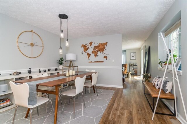 3 Treasure Way Unit 3, Ashland, MA 01721 - dining area with a textured ceiling and wood finished floors