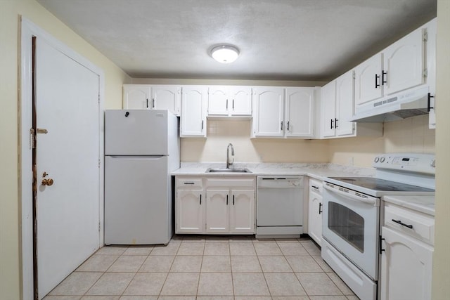 420 Great Rd Unit B9, Acton, MA 01720 - kitchen with white appliances, under cabinet range hood, a sink, white cabinetry, and light tile patterned flooring
