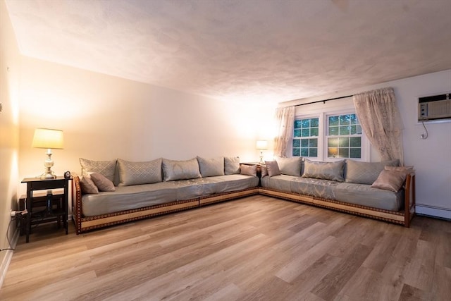 420 Great Rd Unit B9, Acton, MA 01720 - living area with light wood-type flooring and a wall mounted air conditioner