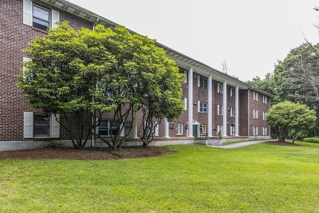 420 Great Rd Unit B9, Acton, MA 01720 - rear view of property featuring a lawn and brick siding