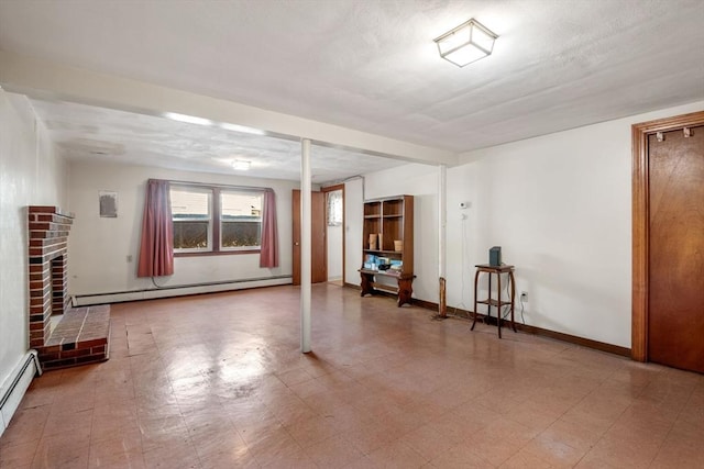 below grade area with baseboards, tile patterned floors, baseboard heating, and a fireplace