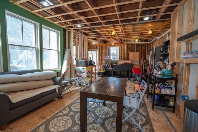 basement featuring freestanding refrigerator