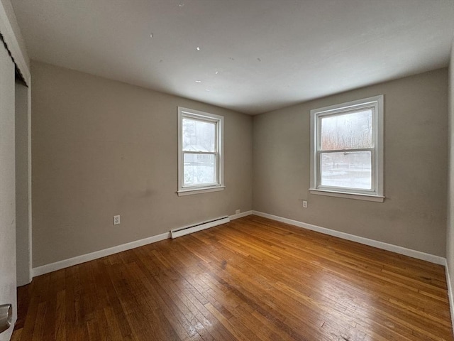 2248 Washington St, East Bridgewater, MA 02333 - unfurnished room featuring hardwood / wood-style floors, baseboard heating, and baseboards