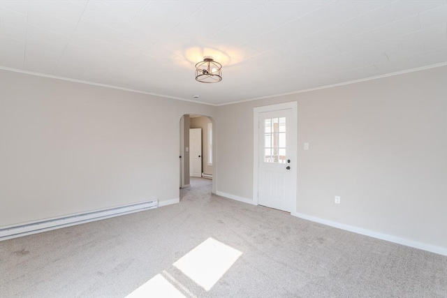 spare room featuring arched walkways, light colored carpet, baseboards, ornamental molding, and baseboard heating