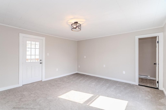 unfurnished room featuring a baseboard heating unit, crown molding, and carpet floors