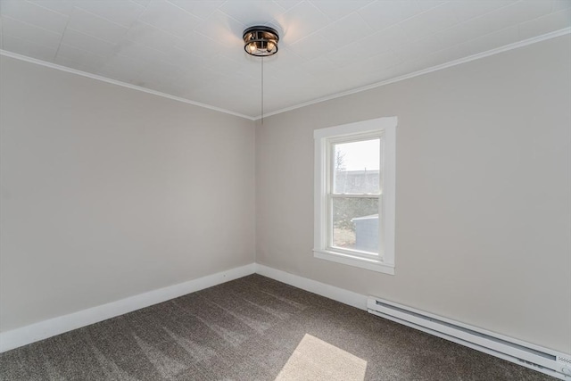 spare room with dark carpet, ornamental molding, a baseboard radiator, and baseboards