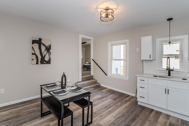 dining room featuring baseboards and dark wood-style flooring