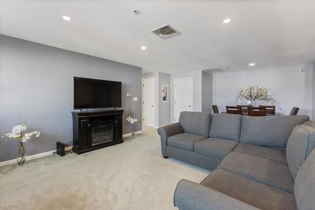 living room with visible vents, recessed lighting, baseboards, and carpet floors