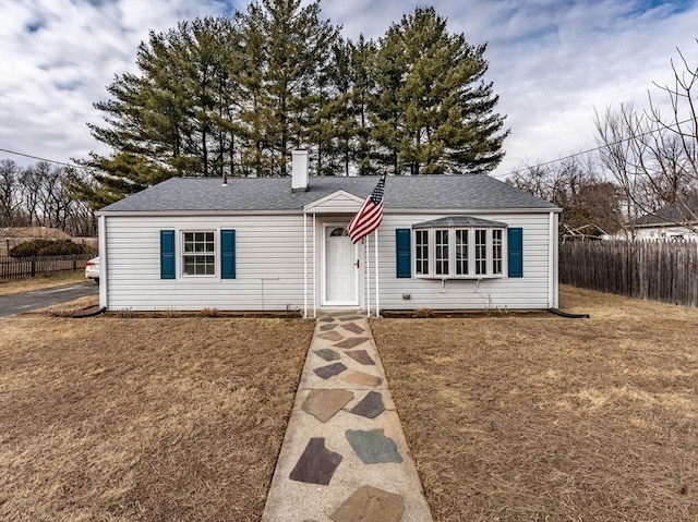 ranch-style home featuring a front yard