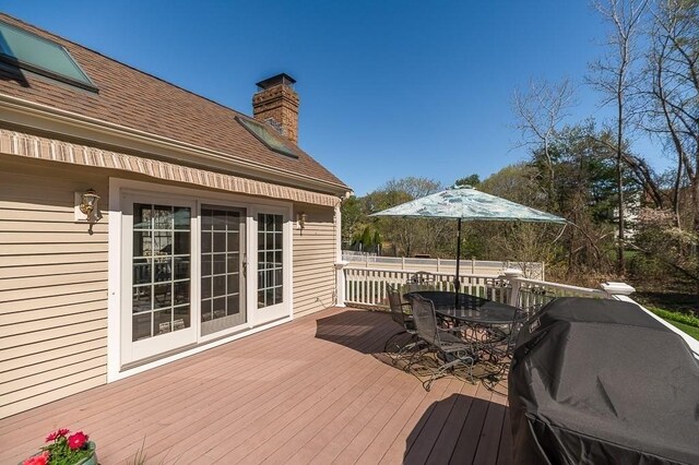 wooden deck with outdoor dining area