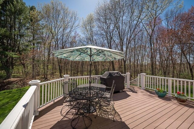 deck with outdoor dining area