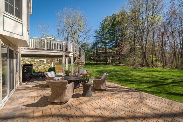 view of patio featuring stairs and a fire pit