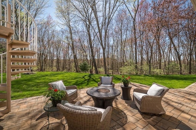 view of patio / terrace with an outdoor fire pit