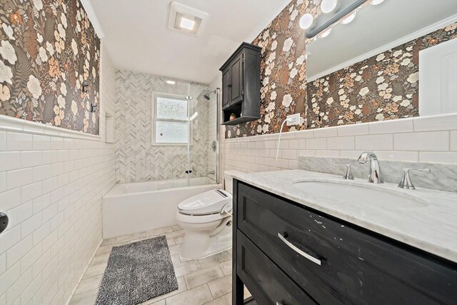359 Corey St, Boston, MA 02132 - bathroom with tile walls, ornamental molding, vanity, toilet, and tub / shower combination